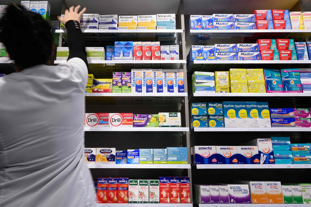 A pharmaceutical assistant holds a drug box in a pharmacy in Riedisheim, eastern France on October 23, 2023. (AFP) A pharmaceutical assistant holds a drug box in a pharmacy in Riedisheim, eastern France on October 23, 2023. (AFP)