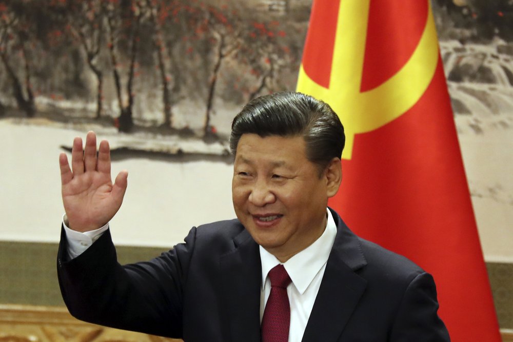 Chinese President Xi Jinping waves during a press event to introduce the new members of the Chinese Politburo in Beijing's Great Hall of the People. (AP) Chinese President Xi Jinping waves during a press event to introduce the new members of the Chinese Politburo in Beijing's Great Hall of the People. (AP)
