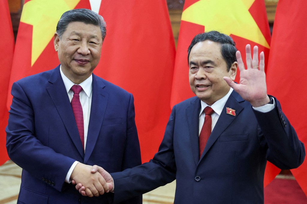 Chinese President Xi Jinping shakes hands with Vietnam's National Assembly Chairman Tran Thanh Man, in Hanoi, Vietnam, April 14, 2025. REUTERS/Athit Perawongmetha/Pool       TPX IMAGES OF THE DAY