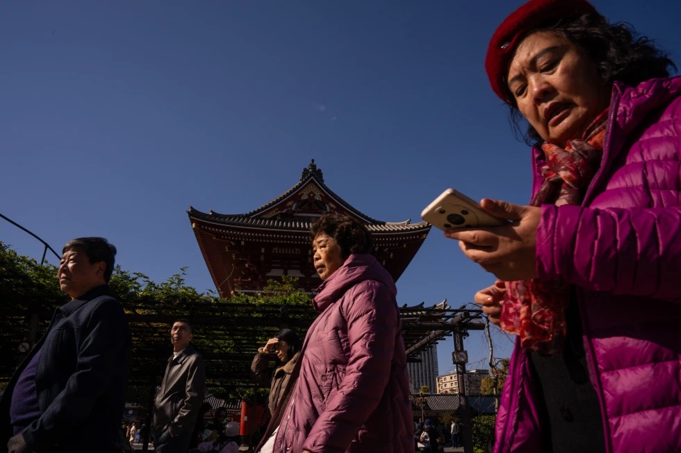 Mainland Chinese tourists visit Sensoji temple in the Asakusa district of Tokyo, Thursday, Nov. 20, 2025. (AP Photo/Louise Delmotte, File)