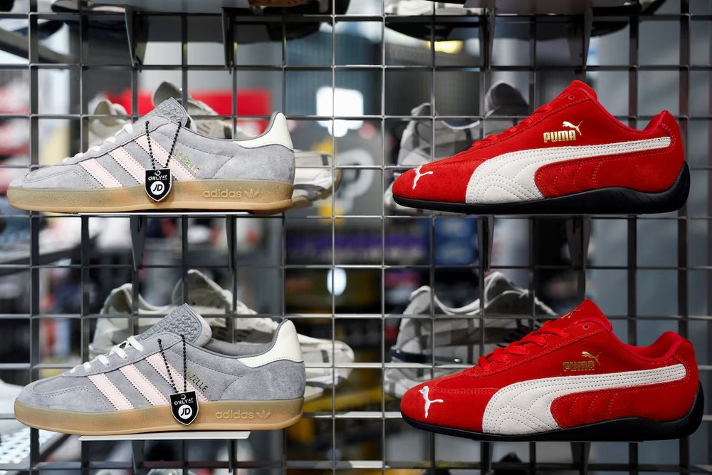 Puma Speedcat OG and Adidas Gazelle sneakers are displayed at a store in Paris, France, January 24, 2025. REUTERS Puma Speedcat OG and Adidas Gazelle sneakers are displayed at a store in Paris, France, January 24, 2025. REUTERS
