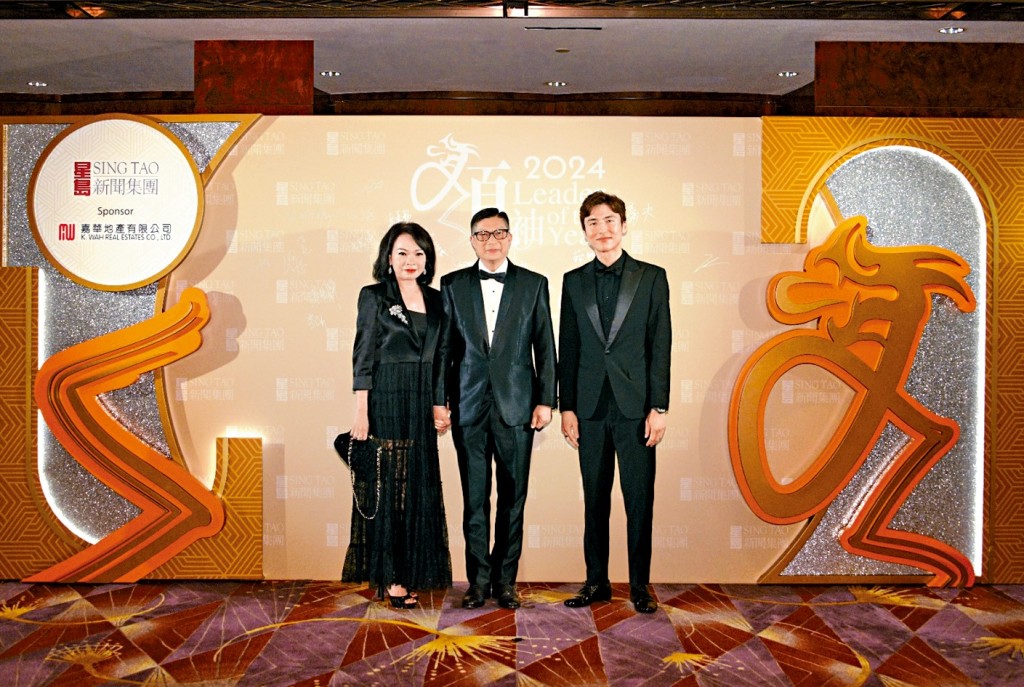 Secretary for Security Chris Tang and his wife with Karson Choi.