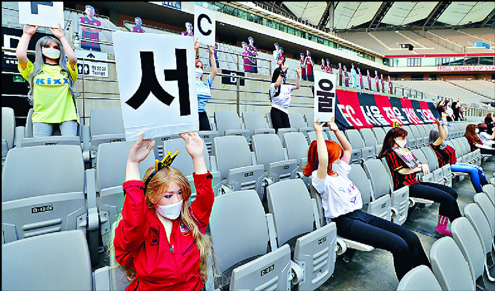 Fans were not impressed with the dolls in the stadium stands. REUTERS Fans were not impressed with the dolls in the stadium stands. REUTERS