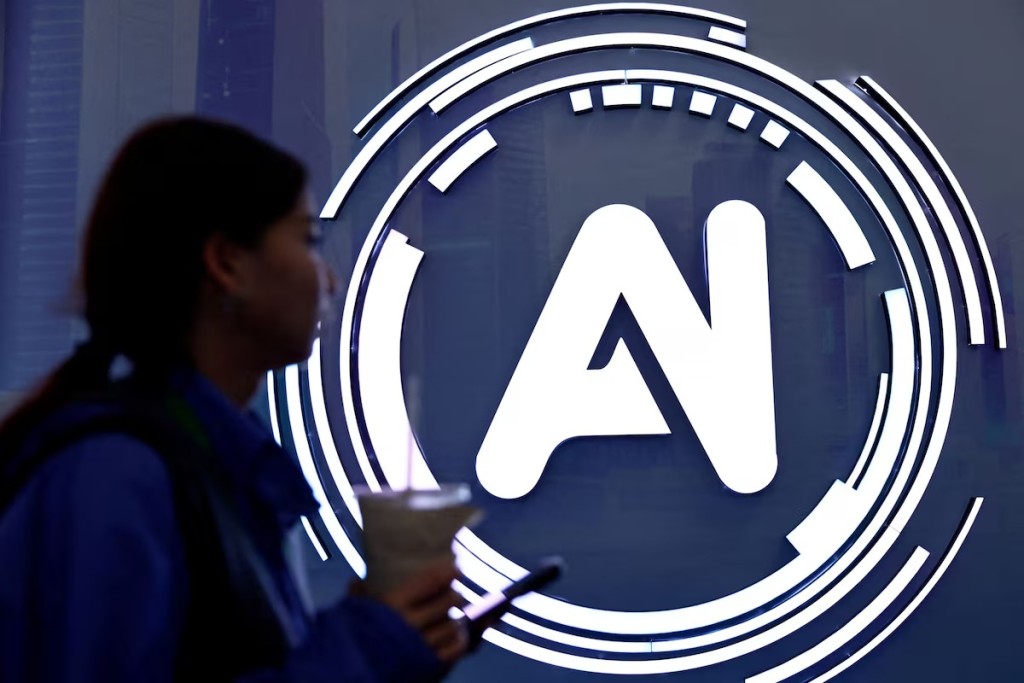 A woman walks past a sign of AI at the expo of the World Internet Conference in Wuzhen town of Tongxiang city, Zhejiang province, China November 8, 2025. REUTERS