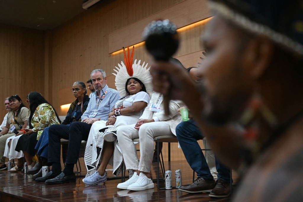 Photo by MAURO PIMENTEL / AFP  Brazil's Minister of Environment Marina Silva (C-L), COP30 President Andre Correa do Lago (C) and Brazil's Minister of Indigenous Peoples Sonia Guajajara (C-R), meet with Pataxo, Munduruku and other Indigenous groups of the Tapajos region, during the COP30 UN Climate Change Conference, in Belem, Para State, Brazil, on November 14, 2025.