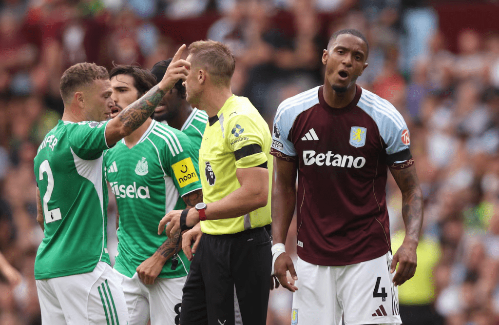 Soccer Football - Premier League - Aston Villa v Newcastle United - Villa Park, Birmingham, Britain - August 16, 2025 Aston Villa's Ezri Konsa reacts after being shown a red card by referee Craig Pawson as Newcastle United's Kieran Trippier gestures REUTERS/David Klein