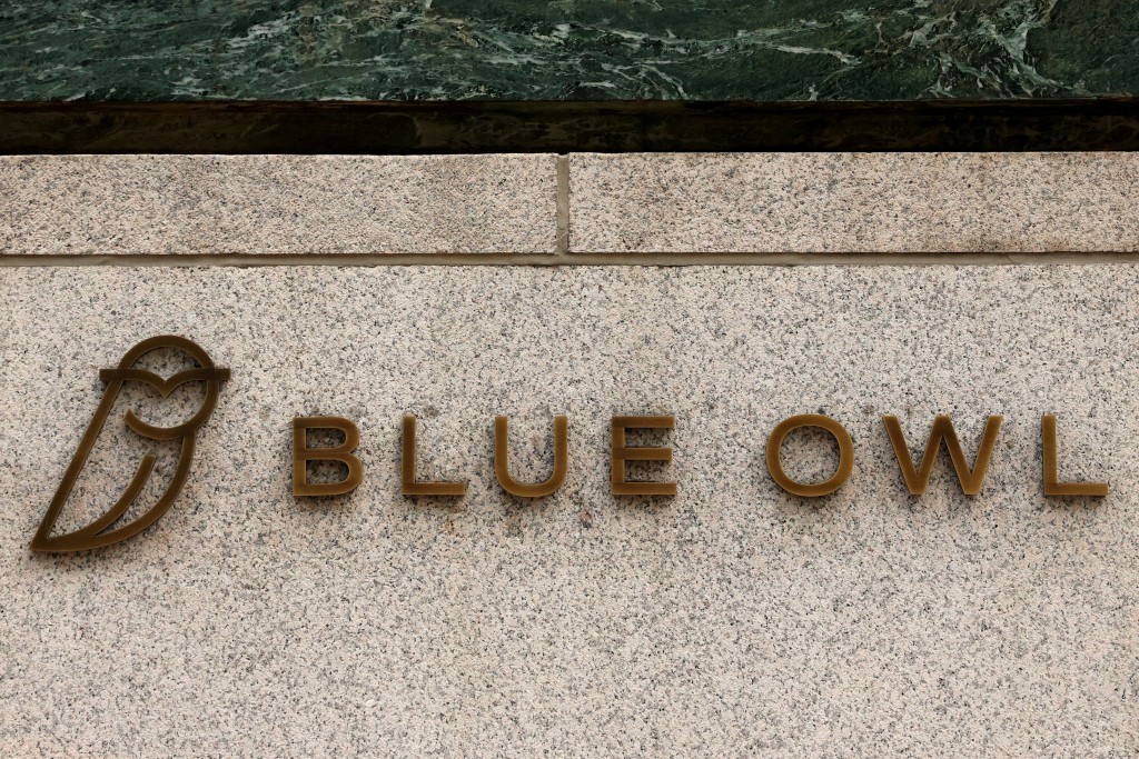 A logo for Blue Owl Capital is displayed on a midtown Manhattan office building in New York City, U.S., February 24, 2026.  REUTERS/Brendan McDermid