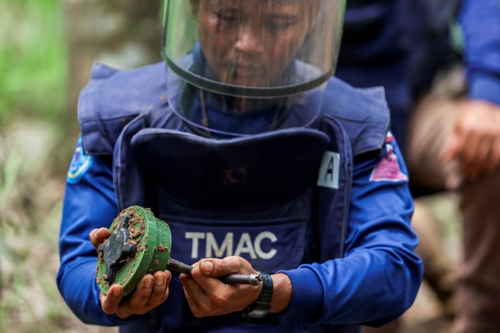 A member of the Thailand Mine Action Centre (TMAC) demonstrates a PMN-2 mine detonation during a media visit organized by the Royal Thai Army, following a ceasefire between Cambodia and Thailand, in Surin province, Thailand, August 20, 2025. REUTERS/Chalinee Thirasupa