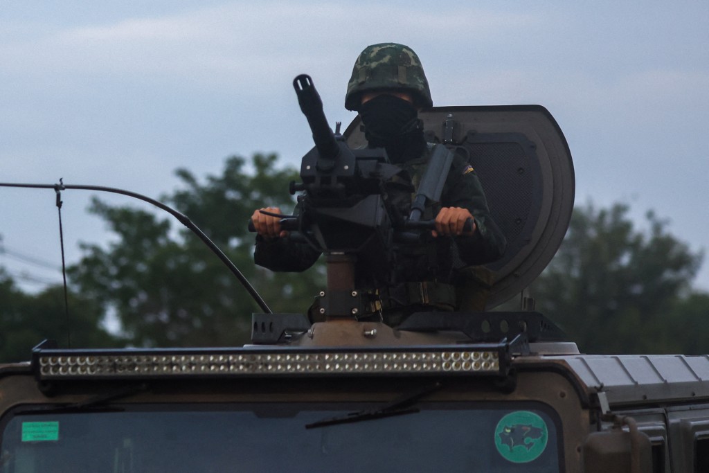 A soldier rides a military vehicle in Buriram province, after Thailand scrambled an F-16 fighter jet to bomb targets in Cambodia following artillery volleys from both sides that killed civilians, Thailand, July 25, 2025. REUTERS/Athit Perawongmetha