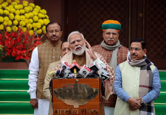 India's Prime Minister Narendra Modi speaks to reporters inside parliament on the first day of the budget session in New Delhi, India, January 31, 2024. REUTERS/Altaf Hussain/File Photo 