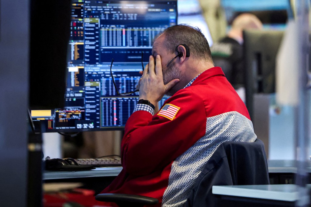 A trader works on the floor at the New York Stock Exchange (NYSE) in New York City, U.S., January 13, 2026.  REUTERS/Brendan McDermid