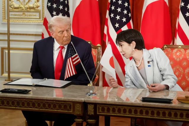 US President Donald Trump, left, and Sanae Takaichi, Japan's prime minister, during a signing ceremony for a document on the implementation of the US Japan trade deal at Akasaka Palace state guest house in Tokyo, Japan, on Tuesday, Oct. 28, 2025. Kiyoshi Ota/Pool via REUTERS/File Photo 