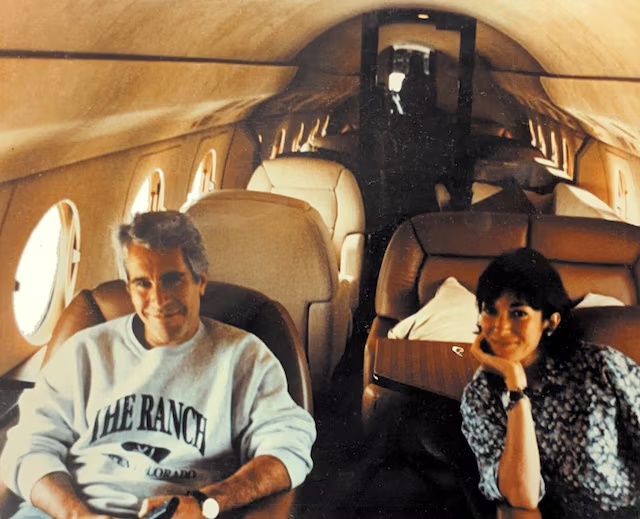Ghislaine Maxwell and Jeffrey Epstein are seen in this image released by the Department of Justice in Washington, D.C., U.S., on December 19, 2025 as part of a new trove of documents from its investigations into the late financier and convicted sex offender Jeffrey Epstein. U.S. Justice Department/Handout via REUTERS 