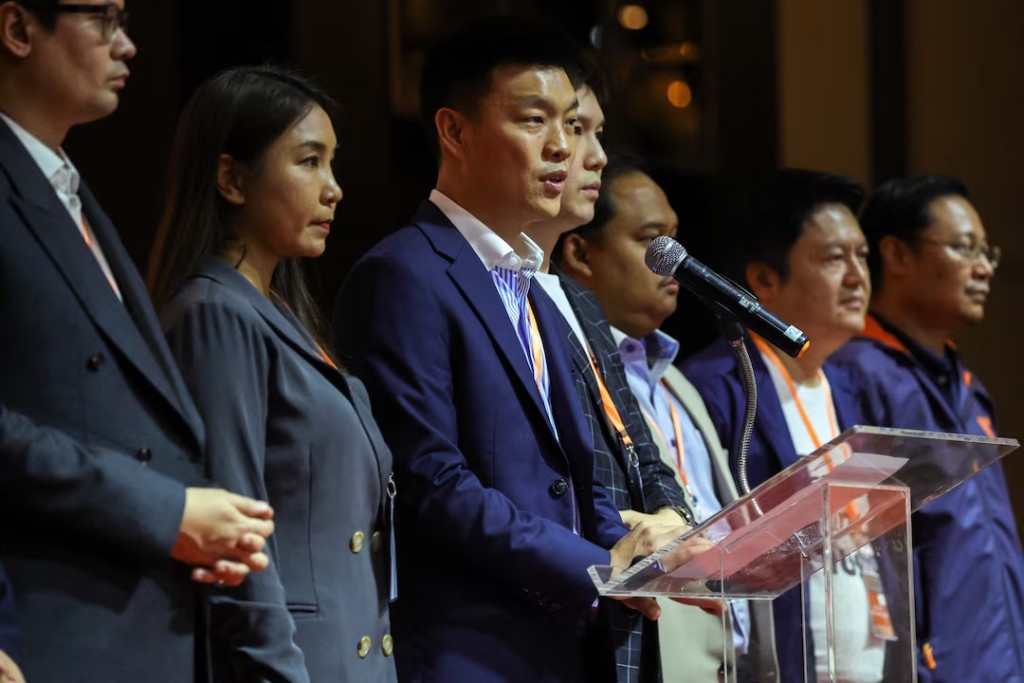 People's Party leader Natthaphong Ruengpanyawut speaks alongside party members of parliament during a press conference following Thailand's Supreme Court's acceptance of a petition that accuses 44 current and former opposition lawmakers of ethics violations over their attempt in 2021 to amend a law that protects the monarchy from criticism, in Bangkok, Thailand, April 24, 2026. REUTERS/Athit Perawongmetha