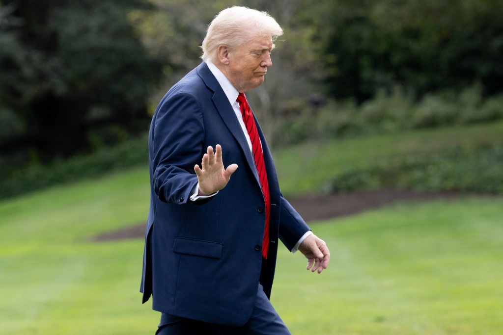 US President Donald Trump walks on the South Lawn of the White House upon returning from Walter Reed National Military Medical Center after a medical checkup on October 10, 2025, in Washington, DC. (Photo by SAUL LOEB / AFP)