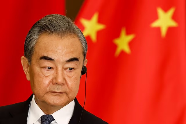 Chinese Foreign Minister Wang Yi listens during a joint press conference with Indonesian Foreign Minister Retno Marsudi (not pictured) following their bilateral meeting in Jakarta, Indonesia, April 18, 2024. REUTERS/Willy Kurniawan/File Photo
