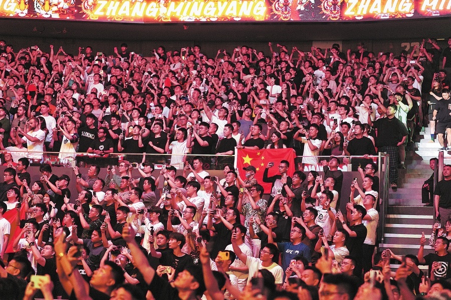 Fans fill the Shanghai Indoor Stadium for Saturday's MMA extravaganza.  GAO ERQIANG/CHINA DAILY
