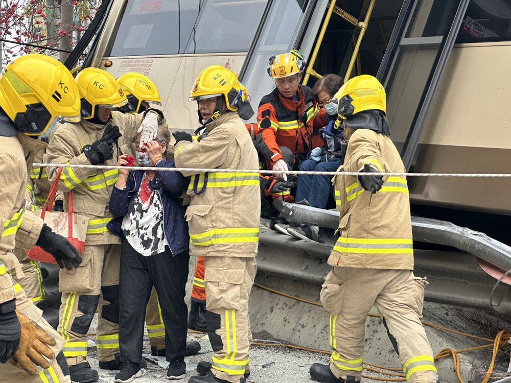 The Fire Services Department said 58 passengers were trapped on the upper deck after the crash, while 14 of the 18 passengers on the lower deck jumped out of the rear emergency exit before first responders arrived.