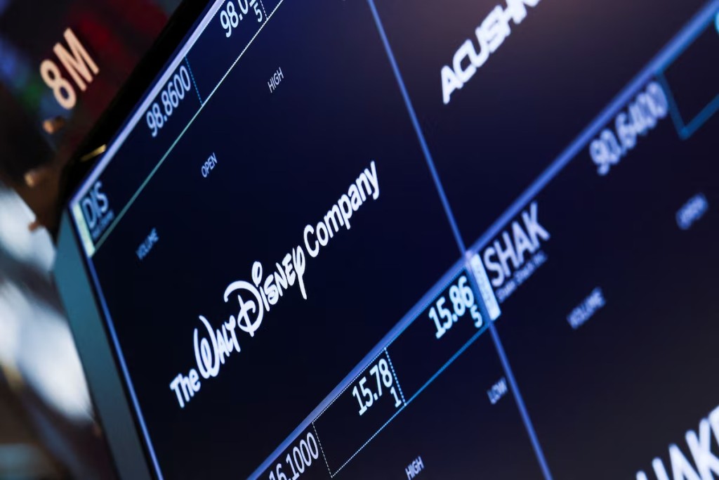 A screen shows the logo and a ticker symbol for The Walt Disney Company on the floor of the New York Stock Exchange (NYSE) in New York, U.S., March 21, 2025. REUTERS