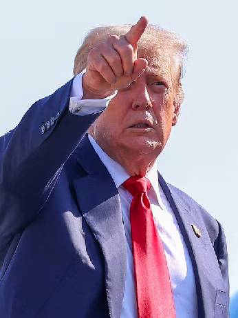U.S. President Donald Trump gestures while boarding Air Force One, as he departs for Scotland, at Joint Base Andrews, Maryland, U.S., July 25, 2025. REUTERS/Evelyn Hockstein