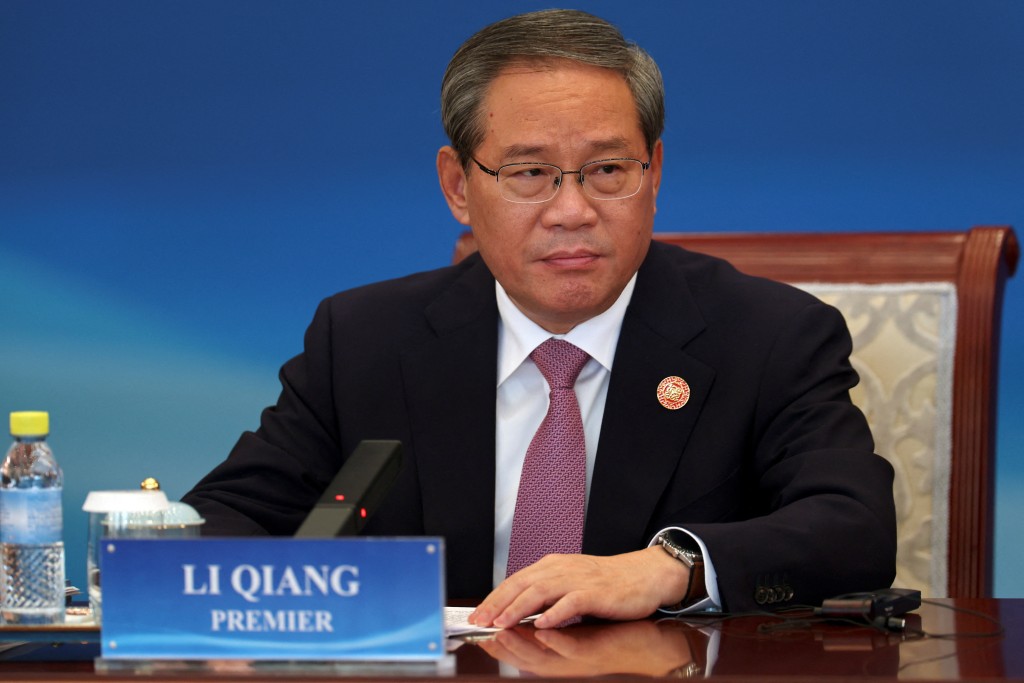 Chinese Premier Li Qiang attends the "1+10" Dialogue with heads of major economic organisations, at the Diaoyutai State Guesthouse in Beijing, China December 9, 2025. REUTERS/Florence Lo