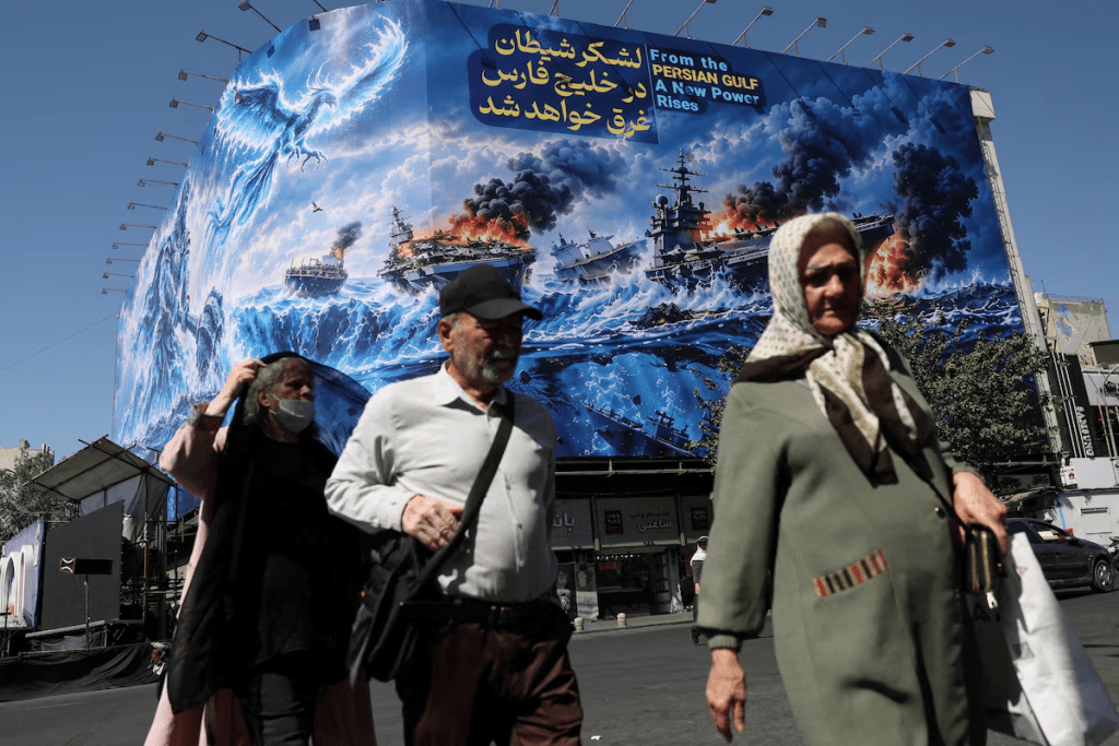 People walk past a billboard about the Strait of Hormuz, on a building in Tehran, Iran, September 16, 2026. Majid Asgaripour/WANA (West Asia News Agency) via REUTERS