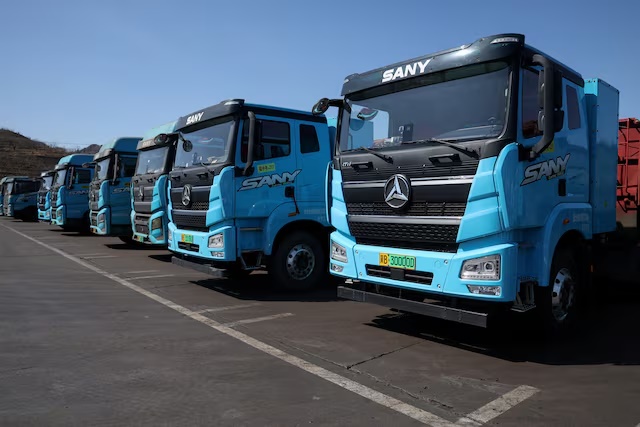 Sany electric heavy trucks are parked at a fleet depot equipped with electric truck charger, in Tangshan, Hebei province, China, April 1, 2026. REUTERS/Tingshu Wang/File Photo 