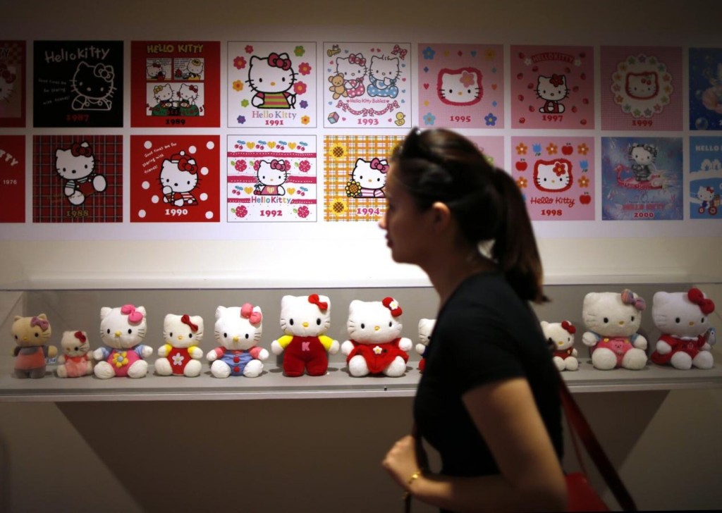A woman walks past a display case at the "Hello! Exploring the Supercute World of Hello Kitty" museum exhibit in honor of Hello Kitty's 40th anniversary, at the Japanese American National Museum in Los Angeles, California October 10, 2014. REUTERS/Lucy Nicholson