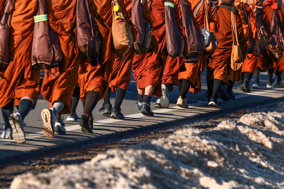 A group of Buddhist monks walk north on U.S. Route 1 during the "Walk for Peace" in Spotsylvania, Virginia, February 5, 2026. REUTERS/Evelyn Hockstein
