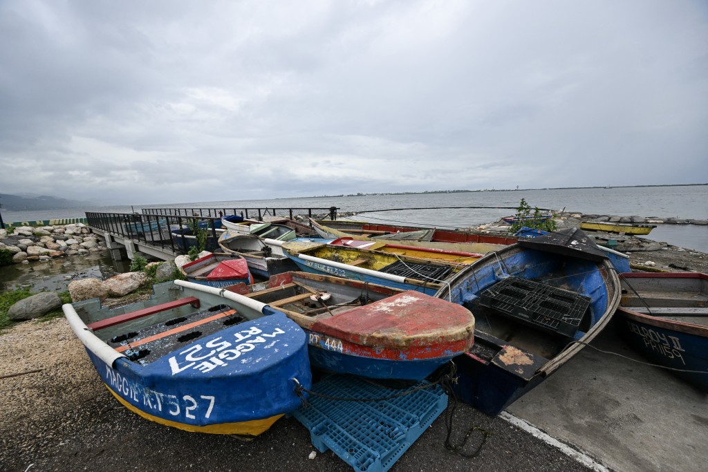 Photo by RICARDO MAKYN / AFP. Fishermen boats are tied together in preparation for the arrival of Hurricane Melissa near the fishing village of Rae Town, East Kingston, Jamaica, on October 25, 2025.