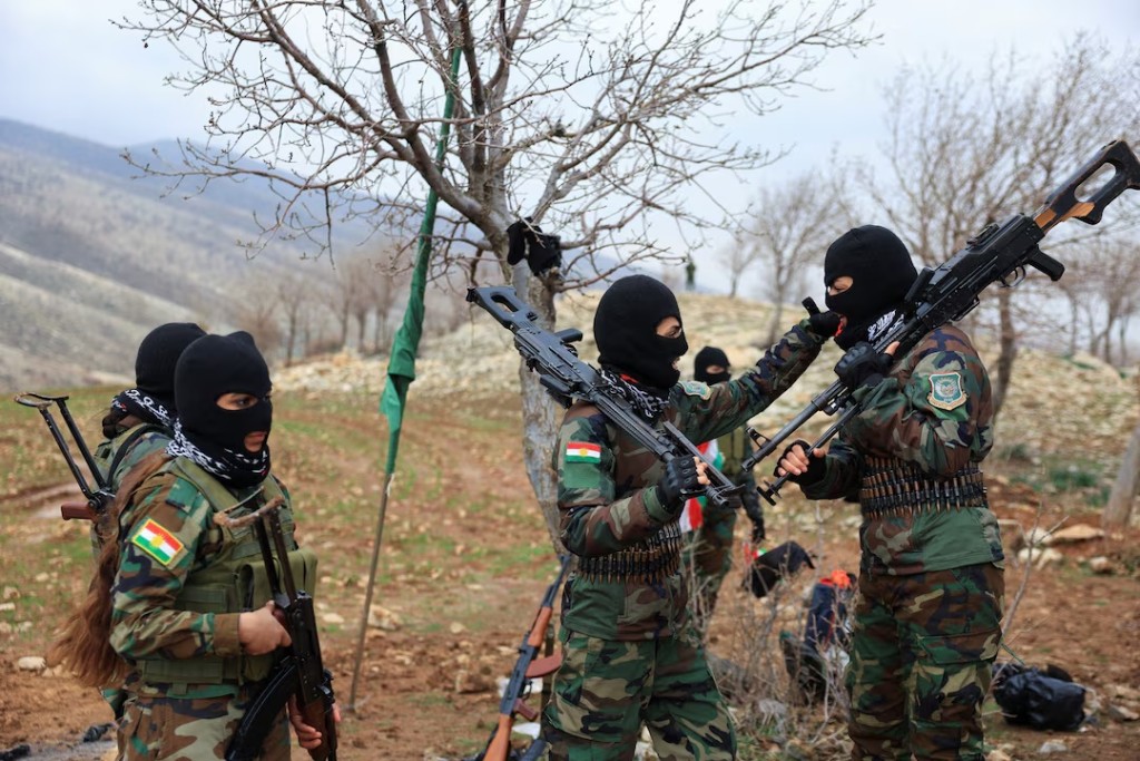 Iranian Kurdish fighters from the Kurdistan Freedom Party (PAK) take part in a training session at a base on the outskirts of Erbil, Iraq February 12, 2026. REUTERS/Thaier Al-Sudani/File Photo 