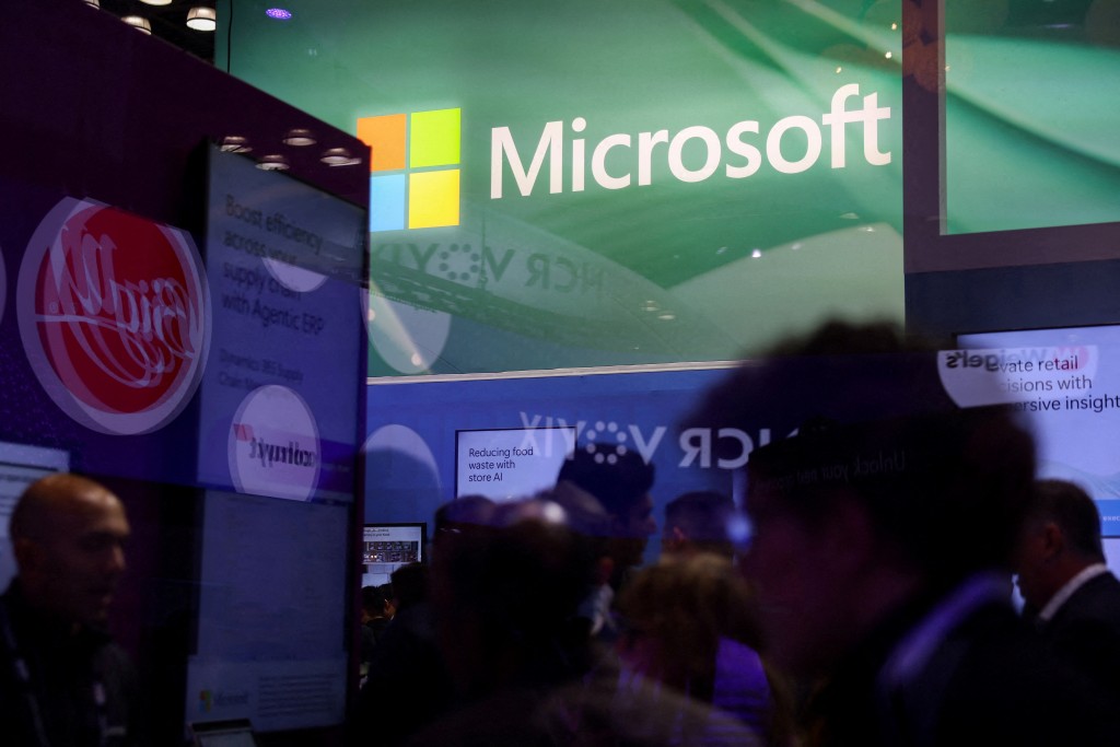 Signage for Microsoft is seen through glass at National Retail Federation (NRF) 2026: Retail's Big Show, in New York City, U.S., January 12, 2026. REUTERS