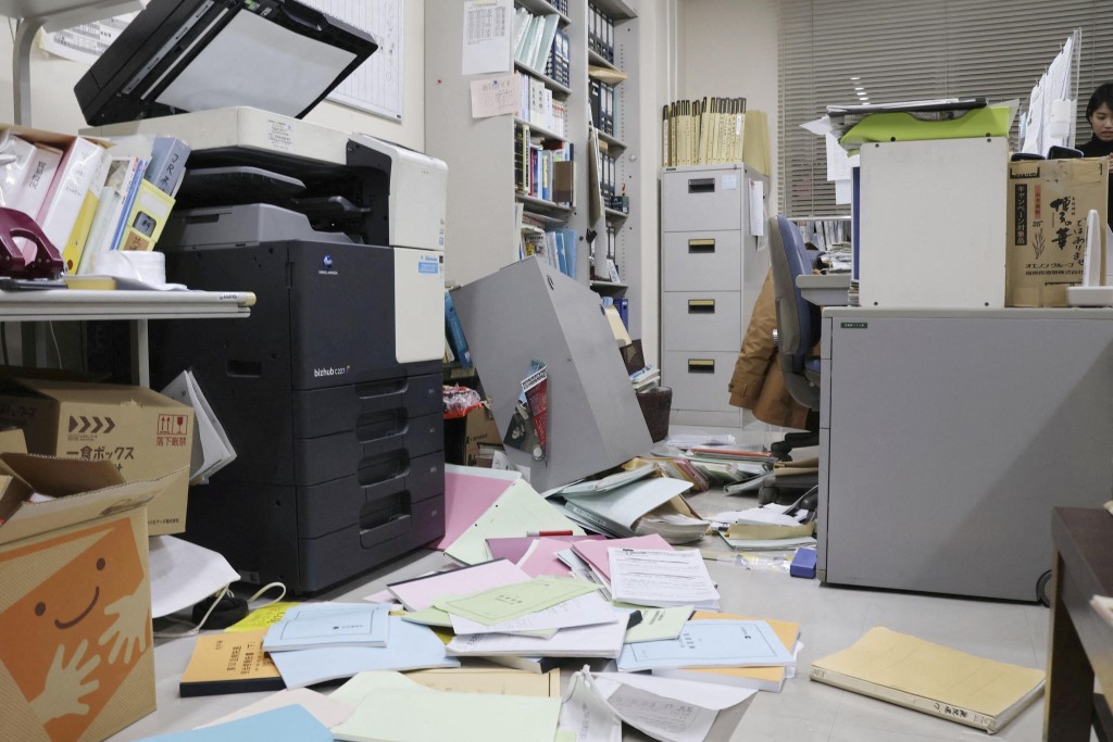 Bookshelves and documents that fell during an earthquake are seen at Kyodo News' Hakodate bureau in Hakodate, Hokkaido, Japan, December 8, 2025 in this photo taken by Kyodo. Mandatory credit Kyodo/via REUTERS 