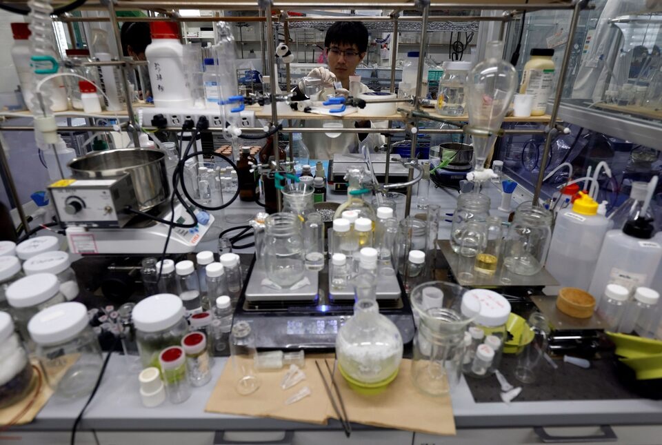 A researcher demonstrates the process of compounding the ocean-degradable plastic raw materials at the Center for Emergent Matter Science (CEMS) of Japanese research institution Riken in Wako, Saitama Prefecture, Japan May 27, 2025. REUTERS/Manami Yamada