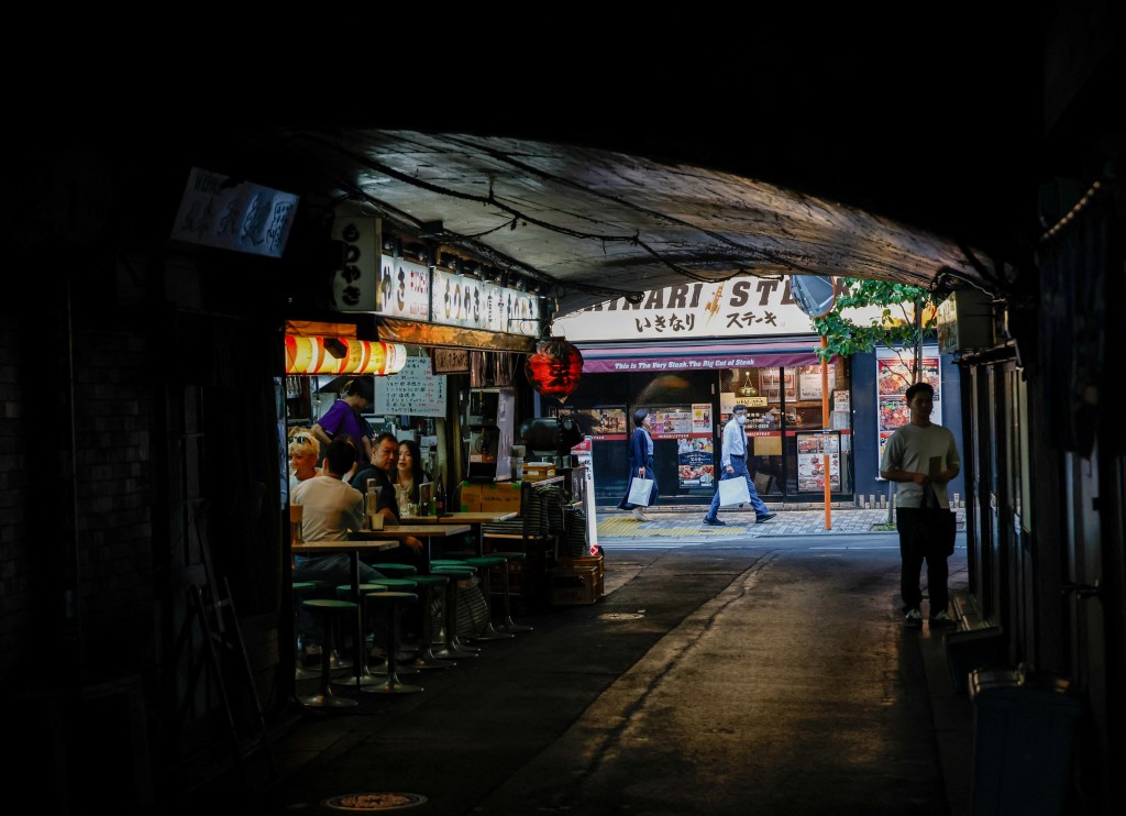 People walk in a restaurant district in Tokyo, Japan, June 15, 2026. REUTERS