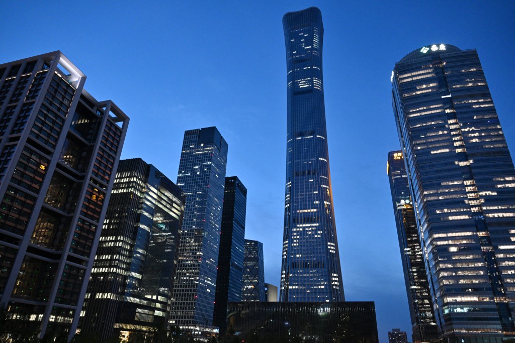 Photo by ADEK BERRY / AFP  Skyscrapers including the CITIC Tower (C) are seen in Beijing on June 26, 2026, after an eyewitness reported plane debris at the base of Beijing's tallest building.
