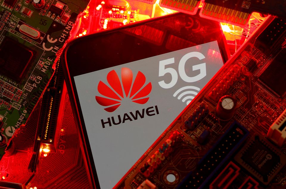 A smartphone with the Huawei and 5G network logo is seen on a PC motherboard in this illustration. (Reuters) A smartphone with the Huawei and 5G network logo is seen on a PC motherboard in this illustration. (Reuters)