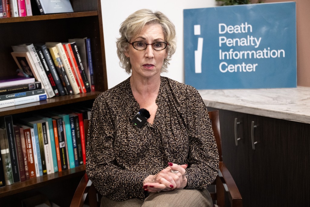 Robin Maher, Executive Director of the Death Penalty Information Center (DPI), a national non-profit organization providing the media, policymakers, and the general public with data and analysis on issues concerning capital punishment and the people it affects, speaks during an interview with AFP at the DPI offices in Washington, DC, October 19, 2026. (Photo by SAUL LOEB / AFP)
