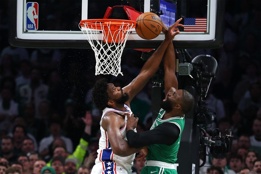 Joel Embiid, who top-scored with 34 points, tries to block a shot by Boston star Jaylen Brown. AFP
