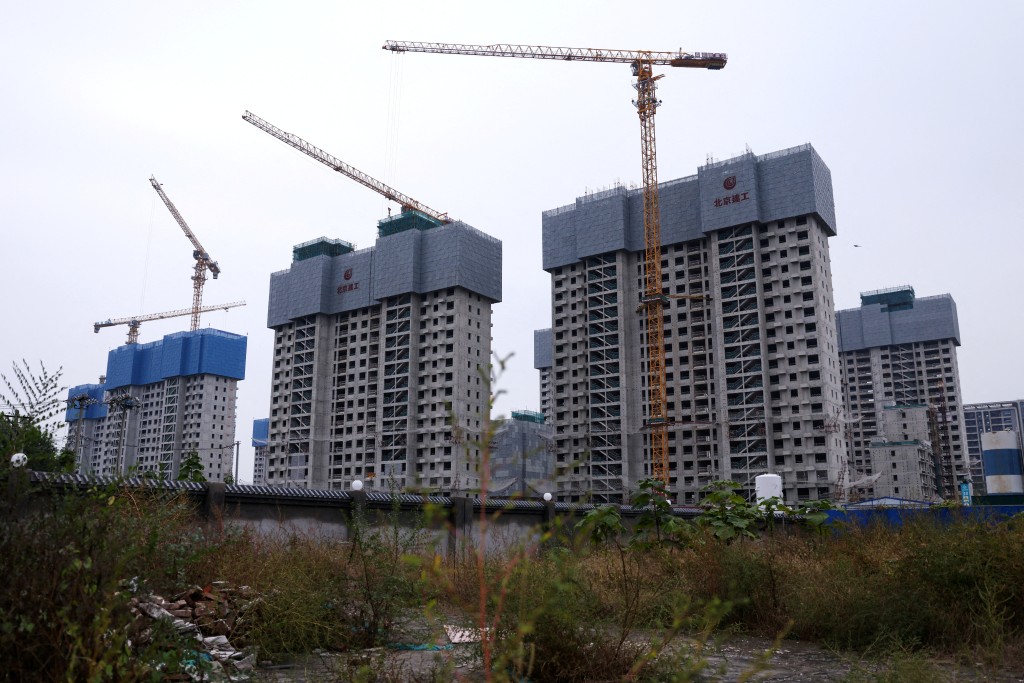 Residential buildings under construction in Beijing, China October 16, 2025. REUTERS/Tingshu Wang
