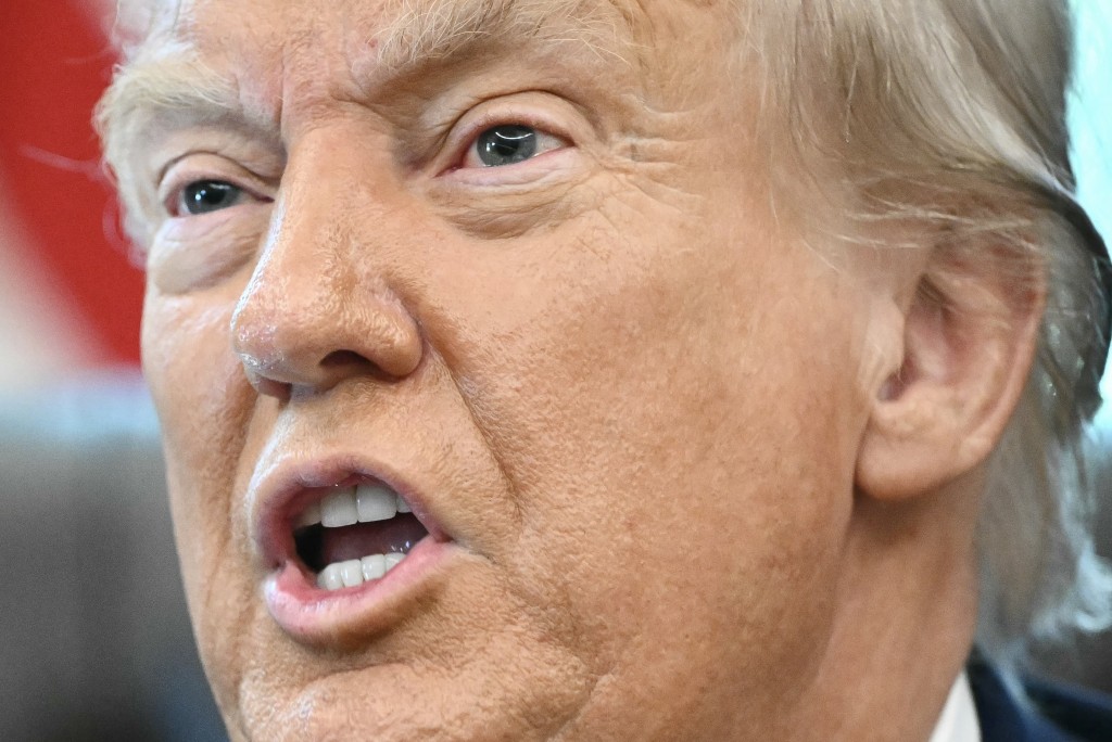 US President Donald Trump speaks to the press after signing an executive order that aims to end cashless bail, in the Oval Office of the White House in Washington, DC on August 25, 2025. (Photo by Mandel NGAN / AFP)