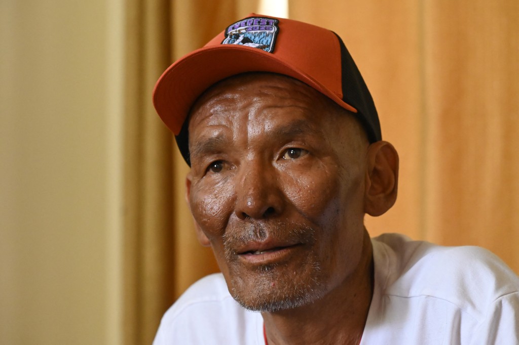 Photo by PRAKASH MATHEMA / AFP Everest survivor Dawa Sherpa speaks during an interview with AFP in Kathmandu on June 18, 2026.