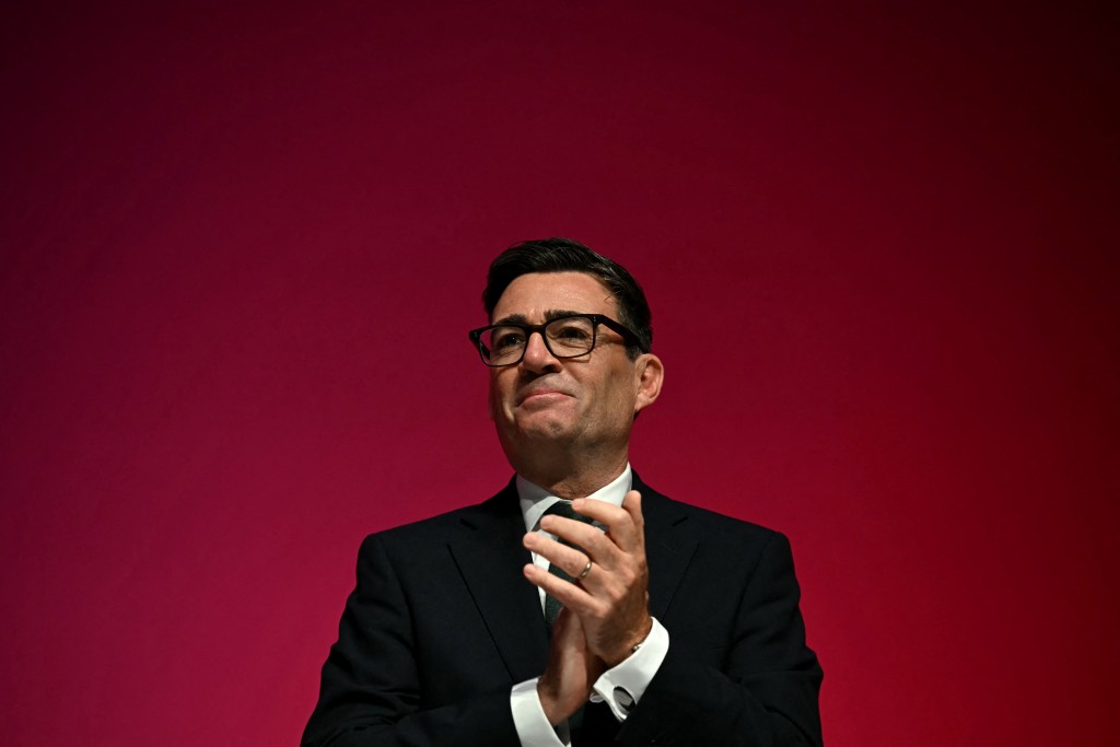 Britain's Prime Minister Andy Burnham applauds on the final day of the annual Labour Party conference in Liverpool, north-west England, on September 30, 2026. (Photo by Paul ELLIS / AFP)