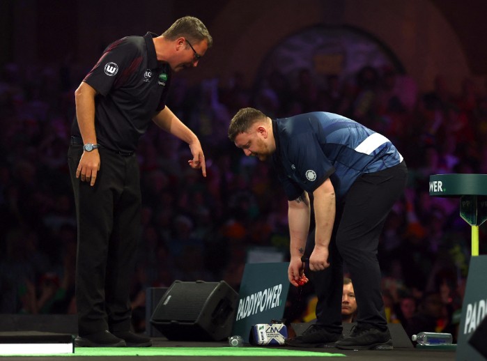 Blood is seen on the hand of Cameron Menzies after he reacts to losing his first round match against Charlie Manby. REUTERS