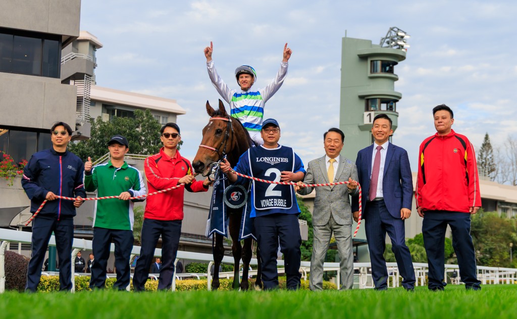 Zac Purton celebrates with connections after Voyage Bubble's victory. Grant Courtney/Idol Horse. 