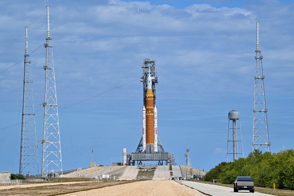 The Space Launch System (SLS) rocket and the Orion spacecraft, integrated for the Artemis II mission, are seen at Launch Pad 39B at the Kennedy Space Center in Cape Canaveral, Florida, on January 30, 2026 ahead of the first crewed mission to the Moon in more than 50 years. (Photo by Miguel J. Rodriguez Carrillo / AFP)