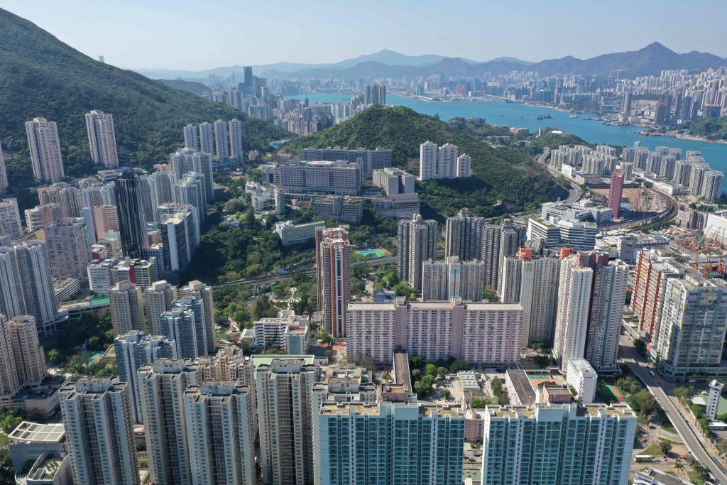 This aerial photo shows a view of residential and commercial tower blocks on the eastern side of Hong Kong island on April 3, 2022. (Photo by Peter PARKS / AFP)