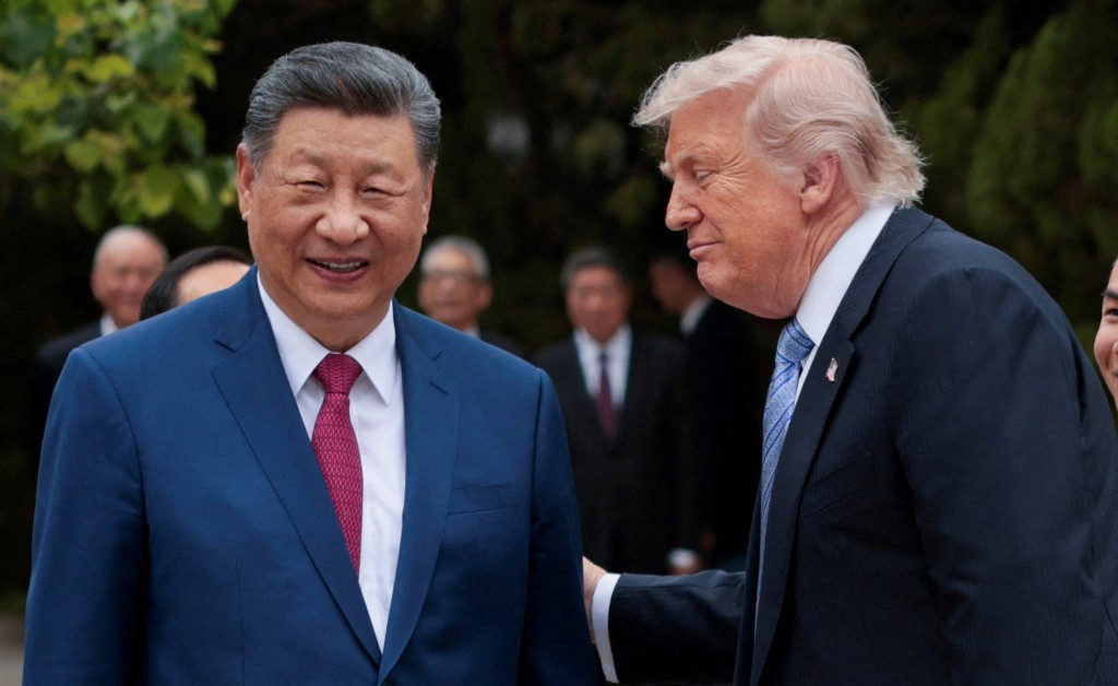 FILE PHOTO: U.S. President Donald Trump speaks with Chinese President Xi Jinping while leaving after a visit to the Zhongnanhai Garden in Beijing, China, May 15, 2026. REUTERS/Evan Vucci/Pool/File Photo