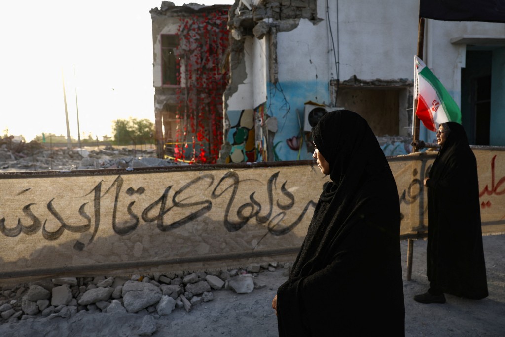 Raheleh, an Iranian woman who lost two of her children in Minab school strike on February 28, reacts at Minab school in Minab, Iran. (Reuters)