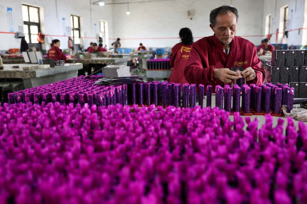 Employees work to assemble firework products at Chili Fireworks in Liling, Hunan province, China, April 10, 2026. REUTERS/Go Nakamura 